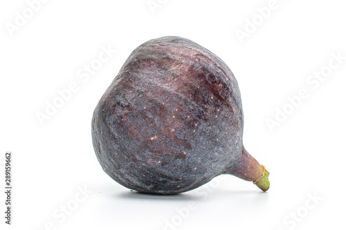 One whole ripe fresh fig fruit isolated on white background