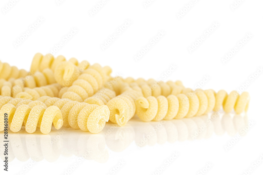 Lot of whole fresh raw pasta fusilli bucati heap isolated on white background Lot of whole fresh raw pasta fusilli bucati heap isolated on white background