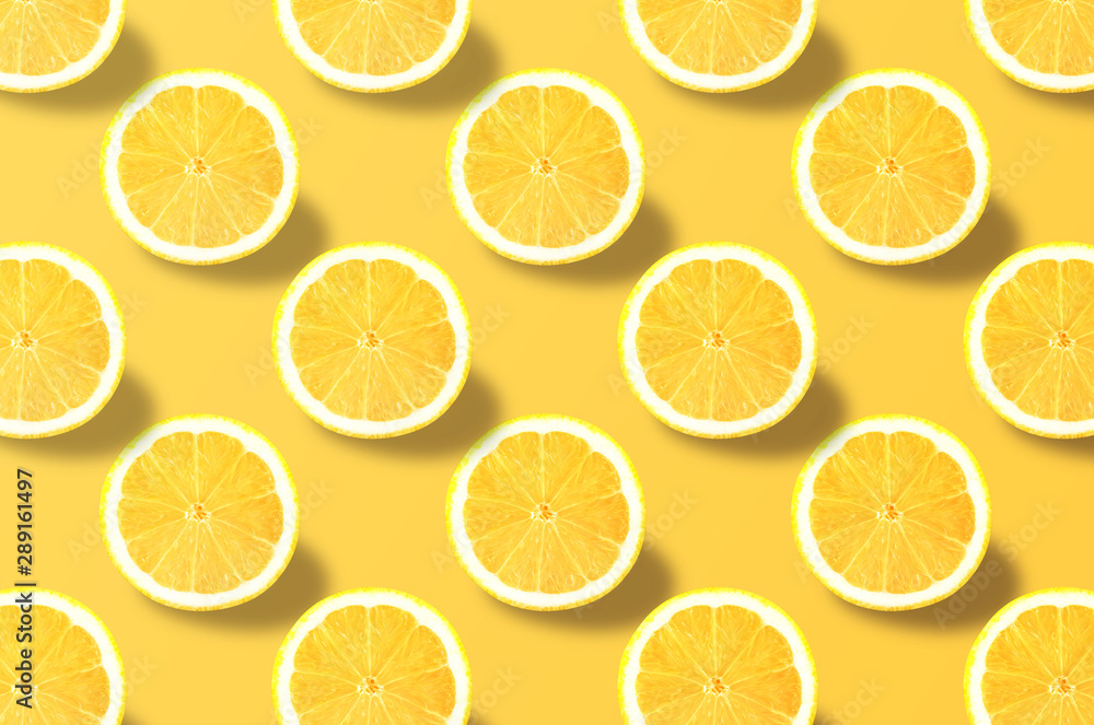 Vivid fruit pattern of fresh lemon on colourful background