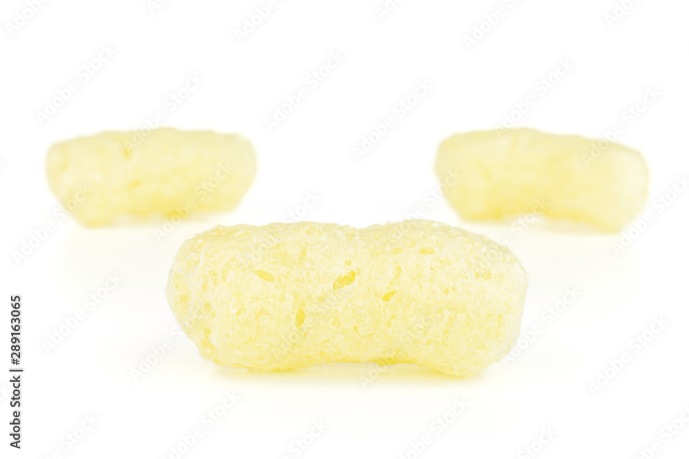Group of three whole salted yellow corn puff isolated on white background Group of three whole salted yellow corn puff isolated on white background