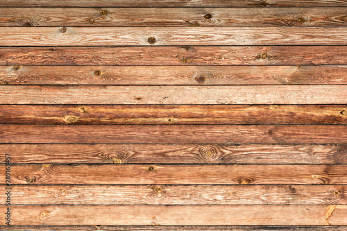 old rough wood panels are horizontal, texture of antique boards, ancient architecture abstract background