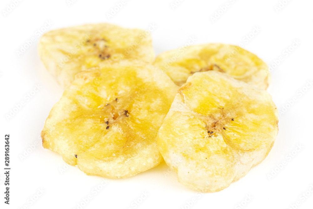 Group of four slices of sweet yellow dry banana isolated on white background Group of four slices of sweet yellow dry banana isolated on white background