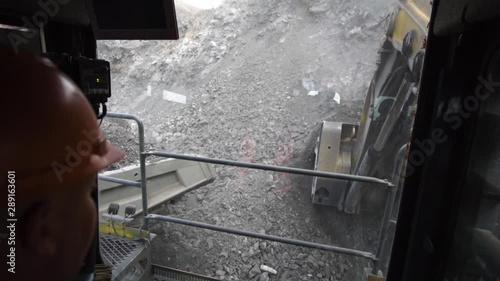 big mining excavator driver at work