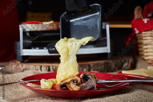 raclette cheese melted with potato and meats