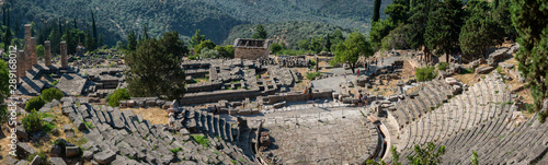 Ancient theatre of Delphi with temple of Apollo , panoramic view from above