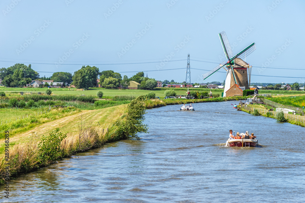 Fototapeta premium Leisure boats in dike canal in the Netherlands