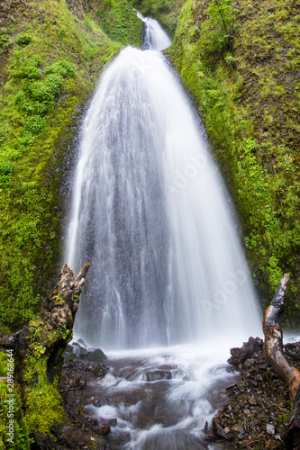 Waterfall flowing down moss covered cliffs - Wahkeena Falls in Oregon s Columbia River Gorge