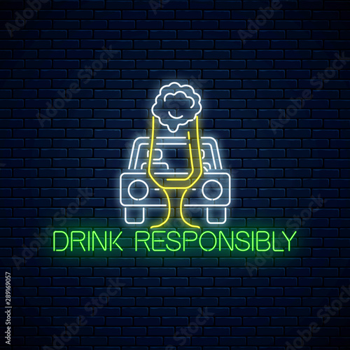 Glowing neon sign of drink responsibly call with car silhouette and glass of beer. Prevent drunk driving symbol