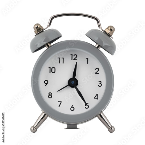 A gray clock with an alarm clock on a white background with arrows showing the time twelve hours twenty five minutes or twenty four hours twenty five minutes