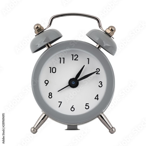 A gray clock with an alarm clock on a white background with arrows showing the time one hour ten minutes or thirteen hours ten minutes