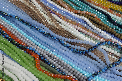 necklaces of precious colored pearls for sale in a jewelry