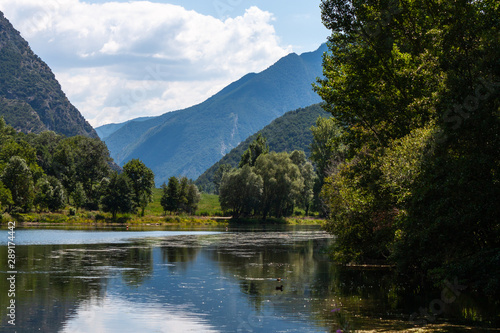 Lake landscape  mountains and forest in a cloudy day. La Torrassa Lake  Pallars Sobir    Pyrenees  Lleida  Catalonia