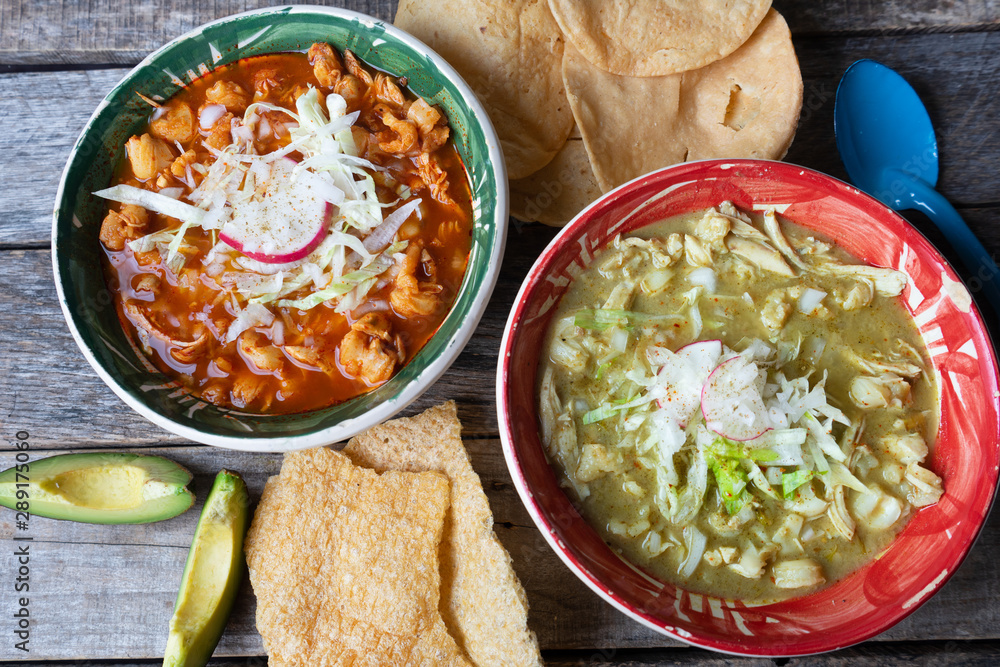 Mexican red and green pozole soup on wooden background Mexican red and green pozole soup on wooden background