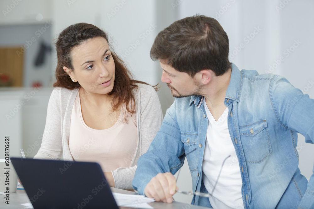 man and woman with laptop computer at home man and woman with laptop computer at home