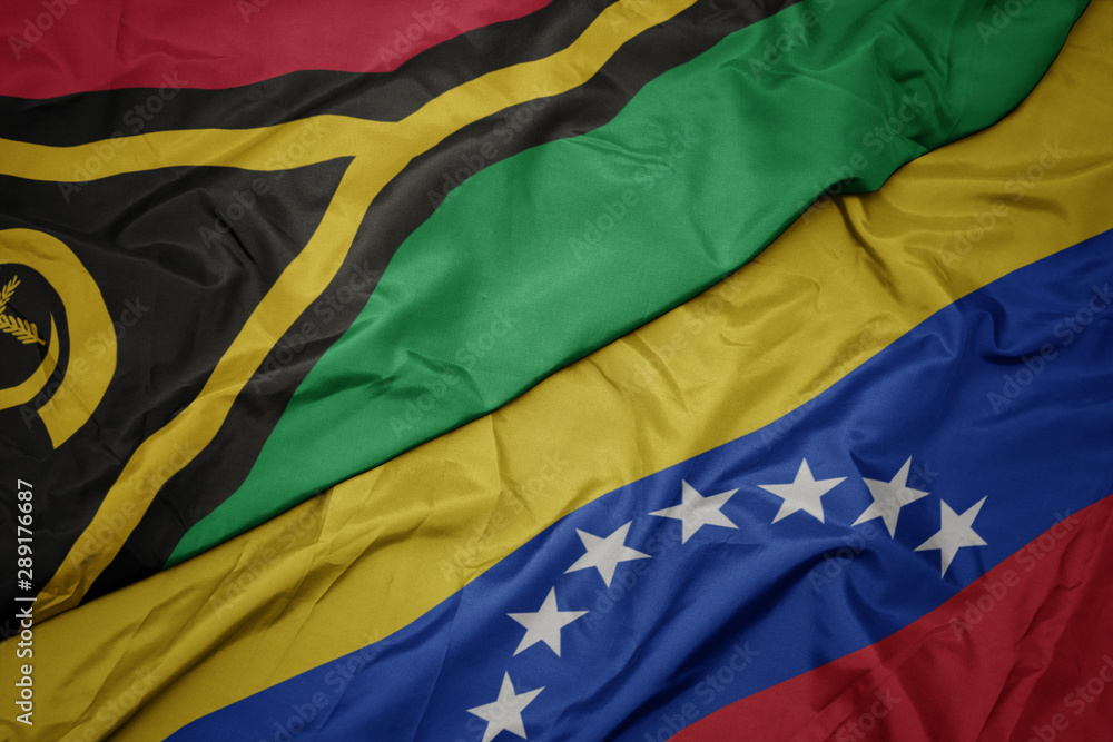 waving colorful flag of venezuela and national flag of Vanuatu .