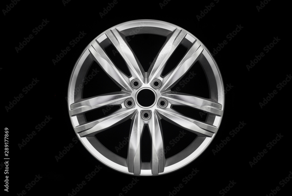 Obraz premium Modern car aluminium alloy wheel isolated on dark background