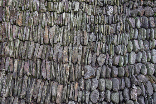 Historic dry stone wall built in traditional Cornish style in England photo