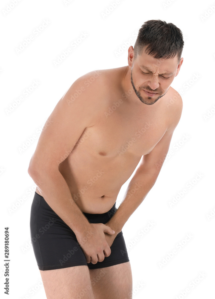 Man suffering from pain on white background. Urology problems