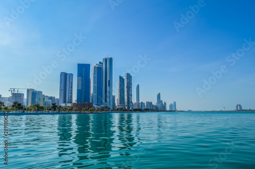 Abu Dhabi city skyline along Corniche beach taken from a boat