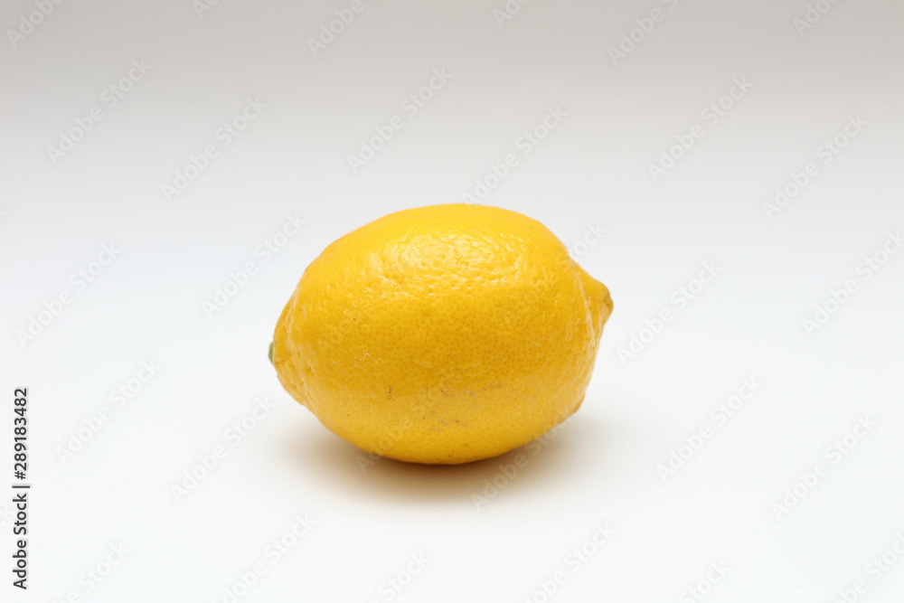 Fresh, ripe, isolated, juicy single lemon on a white background. Studio macro shoot Fresh, ripe, isolated, juicy single lemon on a white background. Studio macro shoot