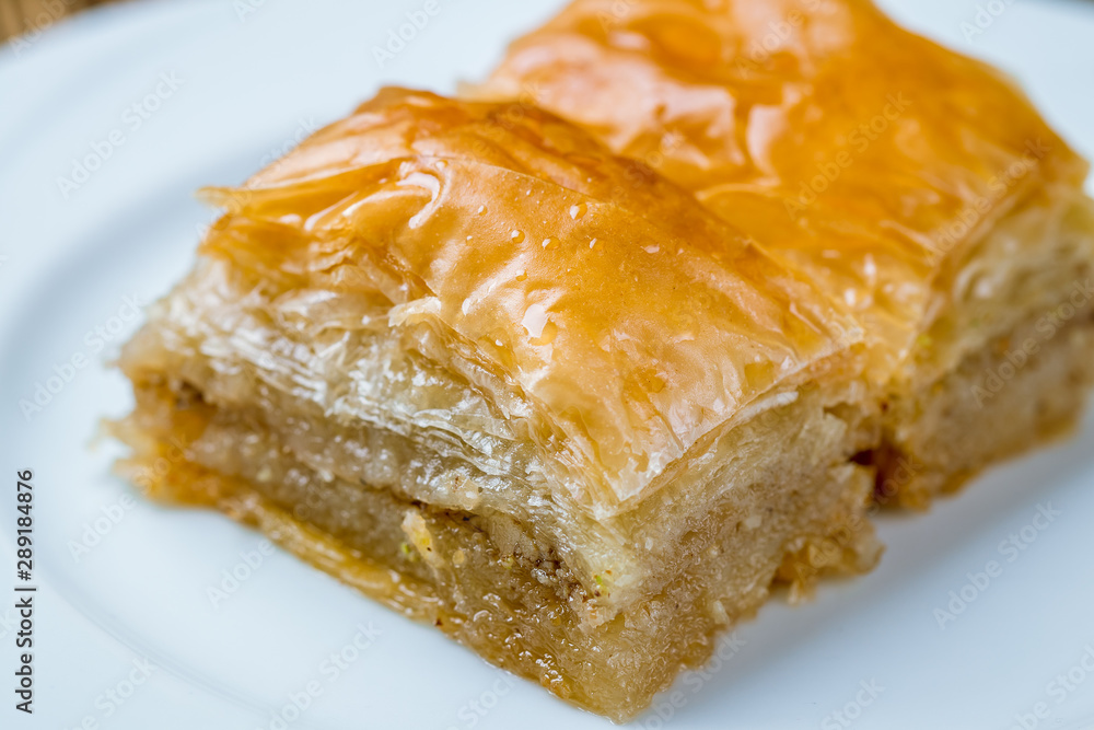baklava with walnuts on wooden table. Turkish cuisine