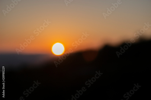 As a visually impaired person sees the sun at sunset. An example of how visually impaired people see it. Without glasses  I see so. Beautiful blurred sunset. Abstract background for illustrations.
