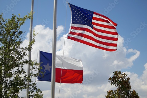 American and Texas Flags Flying At Half Mass