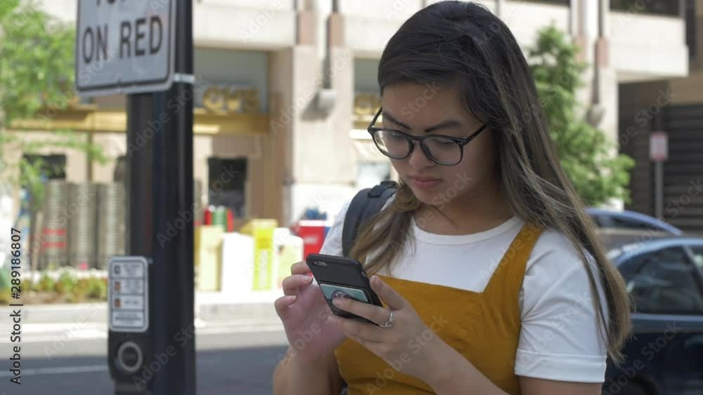 Girl Distracted by Smartphone at Dangerous Traffic Intersection Girl Distracted by Smartphone at Dangerous Traffic Intersection