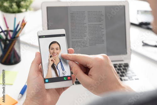 Doctor with a stethoscope. Telehealth conference.