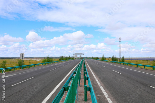 Beautiful highway, under the blue sky and white clouds