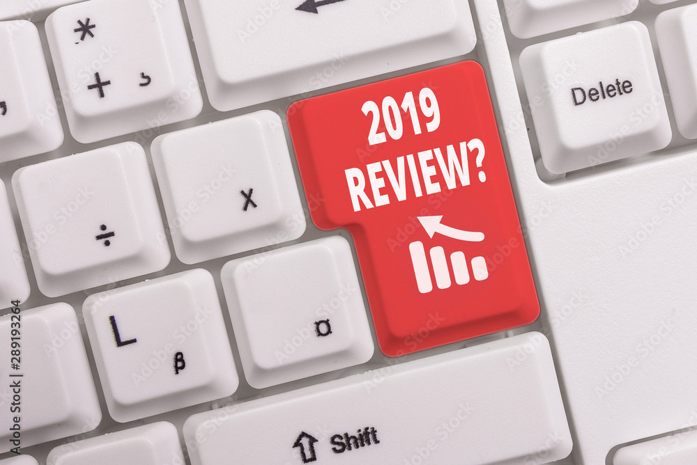 Text sign showing 2019 Review Question. Business photo text remembering past year events main actions or good shows White pc keyboard with empty note paper above white background key copy space Text sign showing 2019 Review Question. Business photo text remembering past year events main actions or good shows White pc keyboard with empty note paper above white background key copy space
