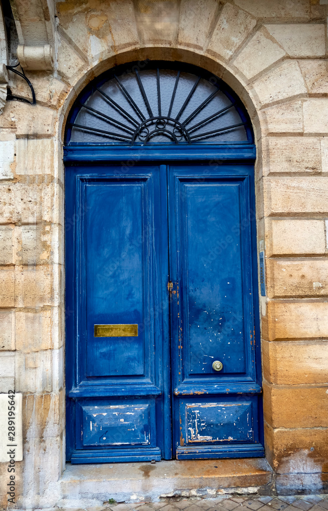 old blue wooden door in old building