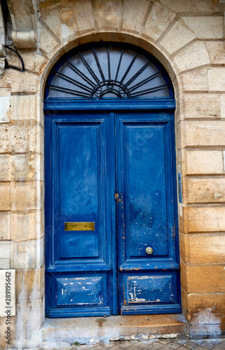 old blue wooden door in old building