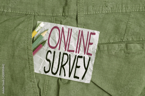 Conceptual hand writing showing Online Survey. Concept meaning Reappraisal Feedback Poll Satisfaction Rate Testimony Writing equipment and purple note paper inside pocket of trousers