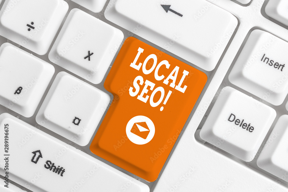 Conceptual hand writing showing Local Seo. Concept meaning incredibly effective way to market your near business online White pc keyboard with note paper above the white background Conceptual hand writing showing Local Seo. Concept meaning incredibly effective way to market your near business online White pc keyboard with note paper above the white background