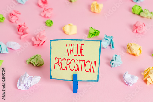 Text sign showing Value Proposition. Business photo text innovation service intended make product attractive Colored crumpled papers empty reminder pink floor background clothespin