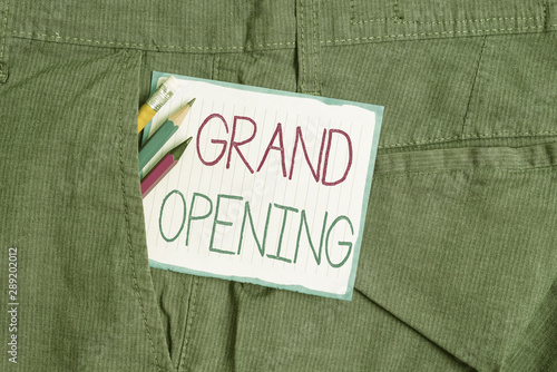 Handwriting text Grand Opening. Conceptual photo Ribbon Cutting New Business First Official Day Launching Writing equipment and white note paper inside pocket of man work trousers