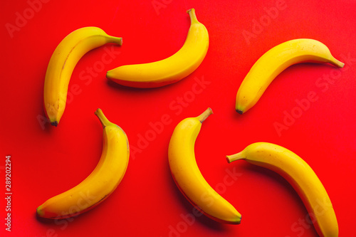 Isolated Bananas on a red background 