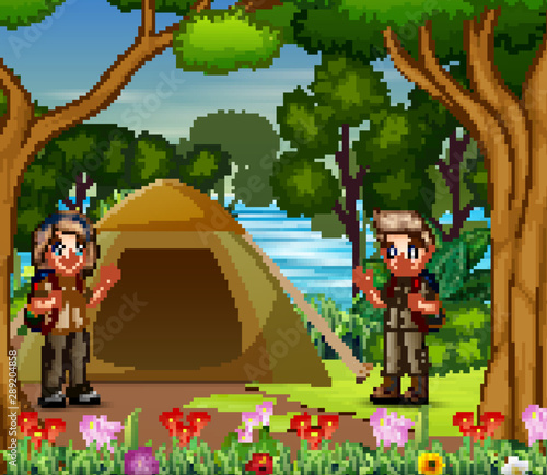 The scout boy and girl camping by the river