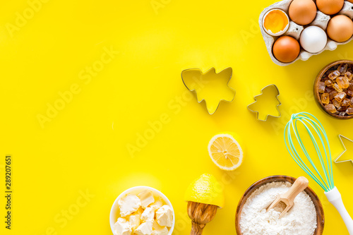 Cooking for Christmas or New Year dinner. . Dough ingredients on yellow background top view space for text