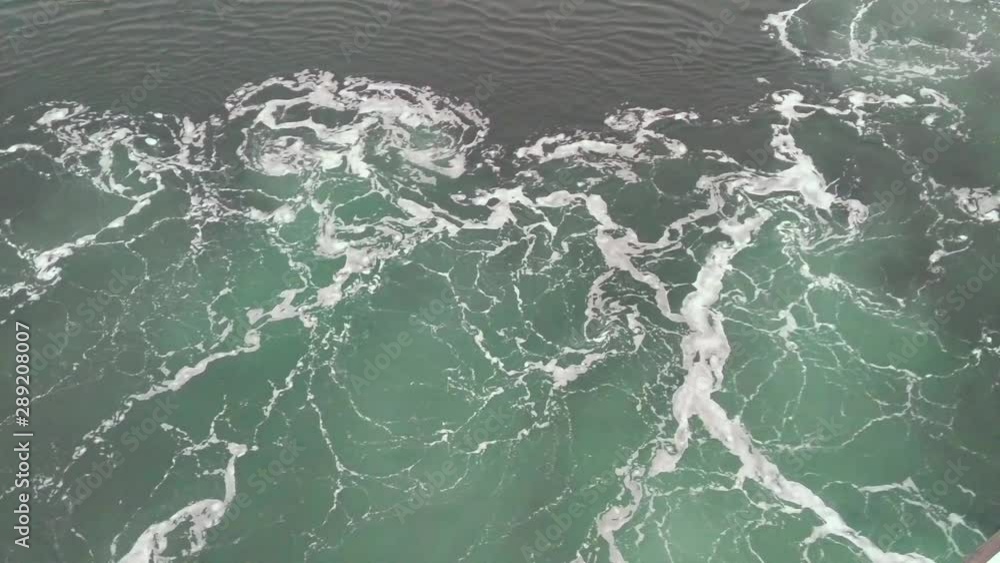 Prop wash flowing past the side of a ship in Puget sound, Prop wash flowing past the side of a ship in Puget sound,