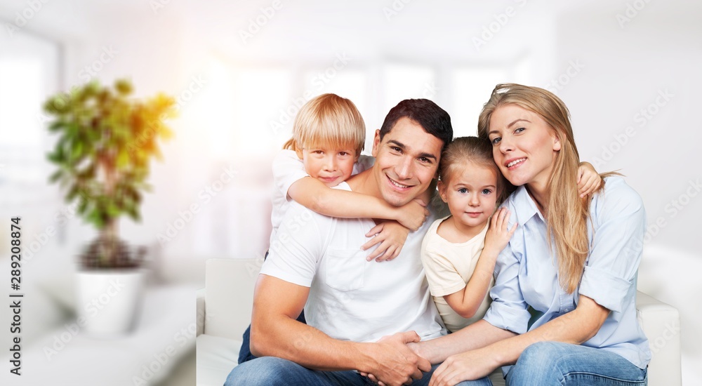 Young family at home smiling at camera Young family at home smiling at camera