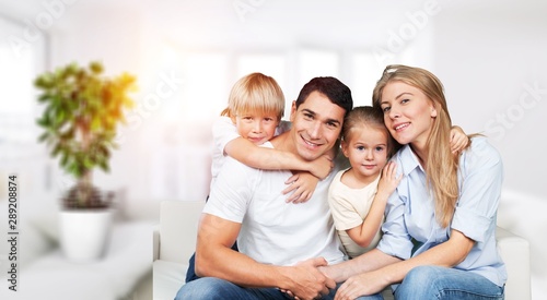 Young family at home smiling at camera © BillionPhotos.com
