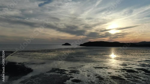 a sunset view of the sea mudflats photo