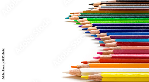 Colored pencils isolated on white background, side view. Wave shaped.
