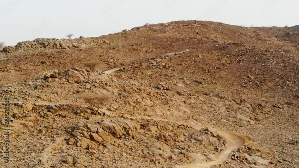 Mountain biking enduro trail path with wooden rest hut checkpoint in Al Taween,Fujairah, UAE Mountain biking enduro trail path with wooden rest hut checkpoint in Al Taween,Fujairah, UAE