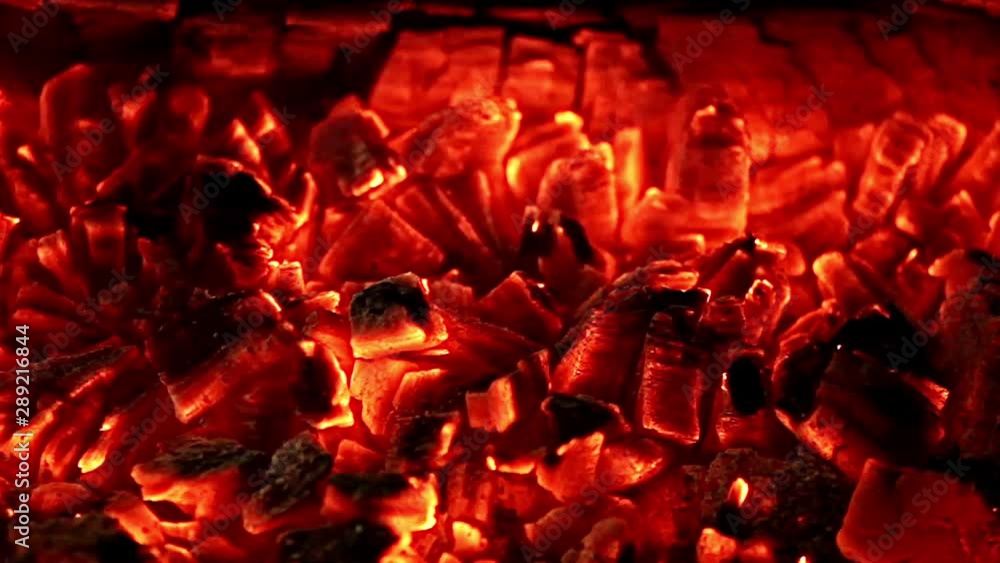 Red hot glowing embers of burning coals at normal speed Red hot glowing embers of burning coals at normal speed