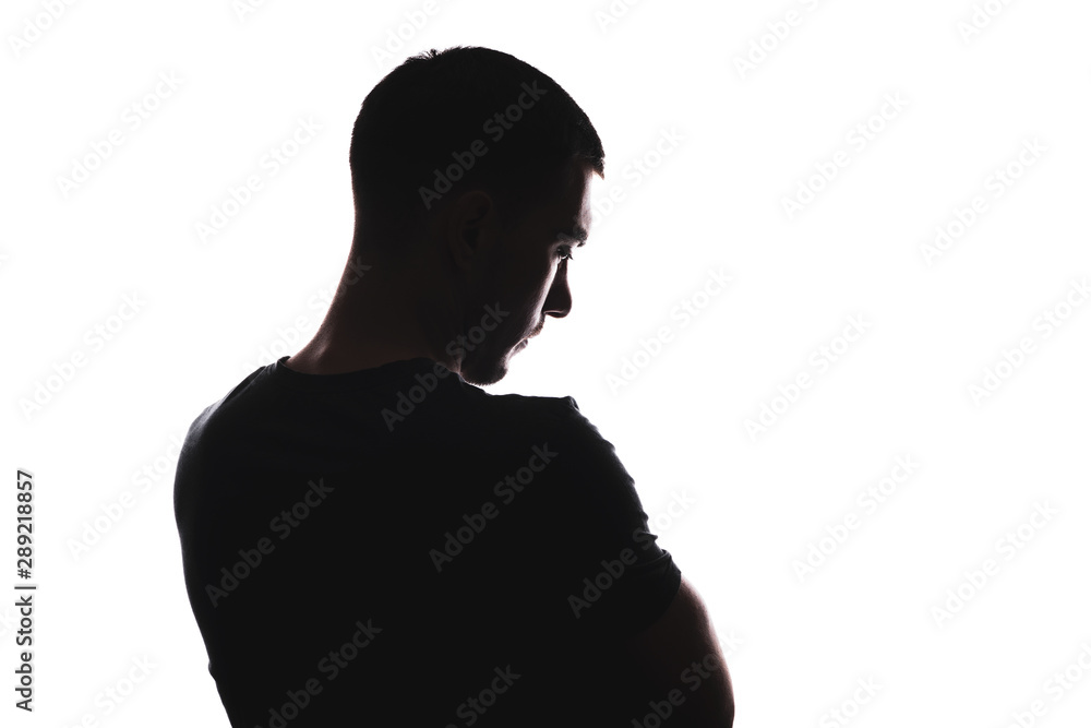 Silhouette portrait of Caucasian male pensive looking, from back looking down, isolated on white background
