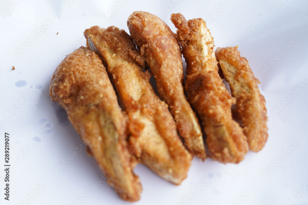 Banana fry in a pan with boiling oil. When finished, looks very appetizing Banana fry in a pan with boiling oil. When finished, looks very appetizing