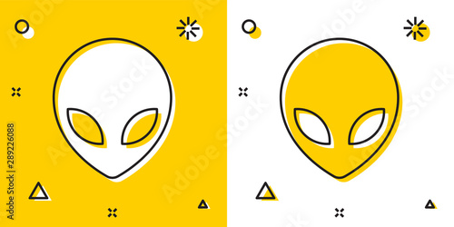 Black Alien icon isolated on yellow and white background. Extraterrestrial alien face or head symbol. Random dynamic shapes. Vector Illustration